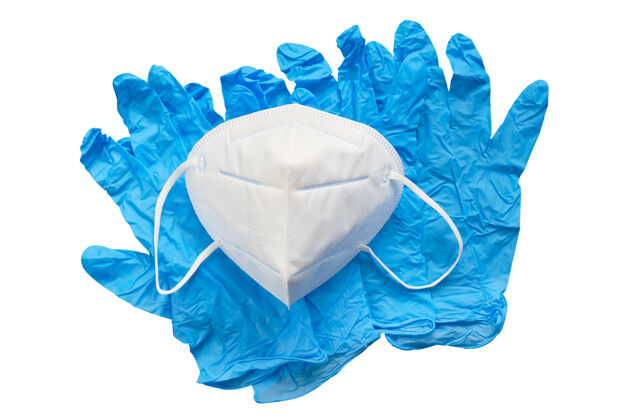 口罩蓝色手术手套和医用面罩隔离在白色表面流感手套诊所