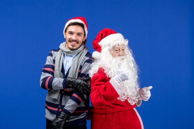 快乐前视图圣诞老人和年轻的男性圣诞节快乐男性