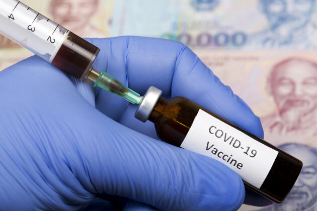 玻璃越南货币背景下的疫苗抗covid-19注射病毒容器