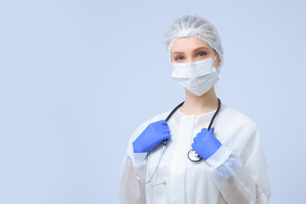 外科帽戴着医疗帽和面罩的女医生或护士的肖像专家护理防护
