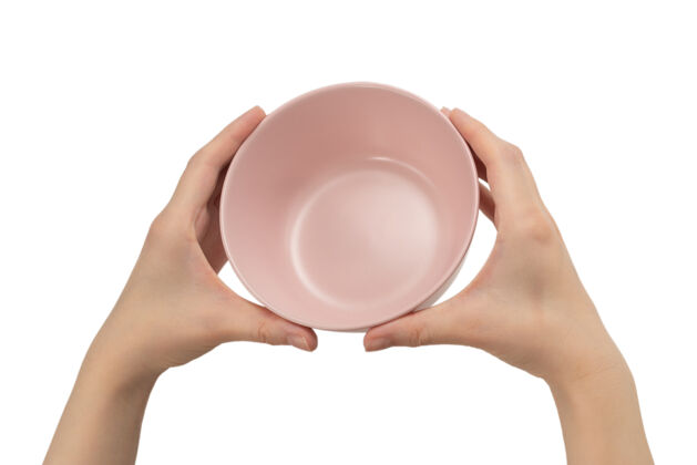 手臂粉红色的盘子在女人手上隔离在白色的背景上等待托盘乐趣