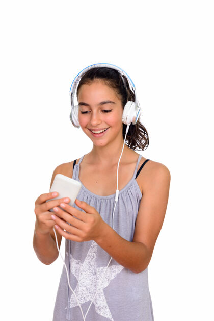 女性年轻漂亮的少女穿着无袖连衣裙与白色空间隔离青少年短信收听
