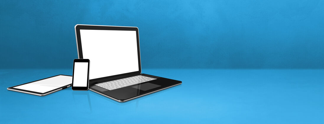 空白空间blueoffice上的笔记本电脑 手机和数字平板电脑书桌.横幅背景灯光互联网显示器