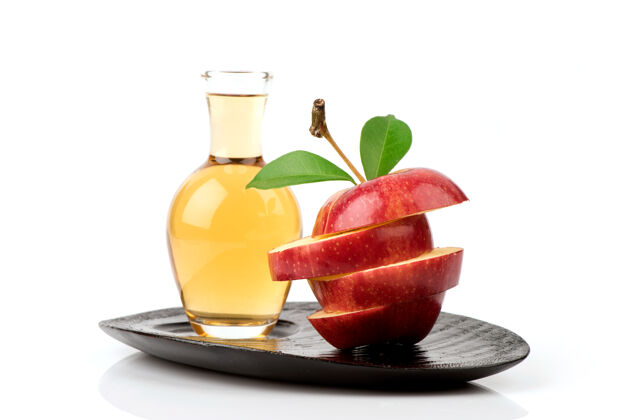 提取物在白色背景上分离苹果水果和苹果醋调味品水果医药