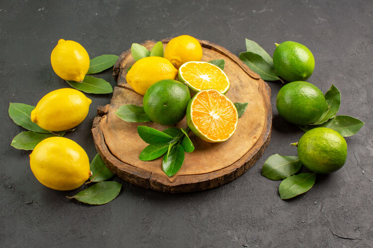 健康前视图新鲜柠檬在黑暗的背景深色酸橙农产品
