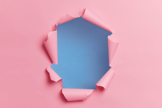 纸张撕破的粉红色背景 中间有洞 适合你的广告内容或促销背景无人空格