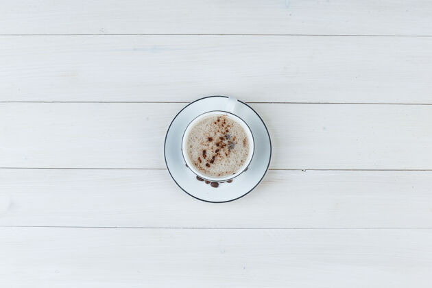 乡村的木制背景上的牛奶咖啡顶视图桌子质地烤