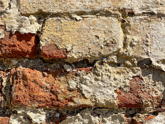 背景一堵旧砖墙的一部分 用砖头围起来古老的砖墙垃圾