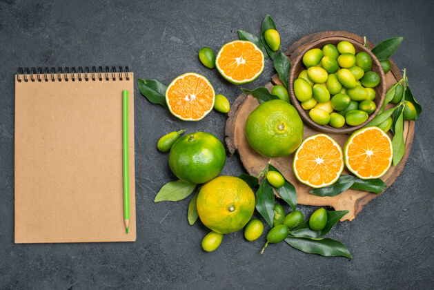 减肥顶部特写查看柑橘水果笔记本绿色铅笔水果板笔记本纸板新鲜
