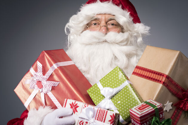 季节圣诞老人有很多礼物盒积极的情绪旧的礼物