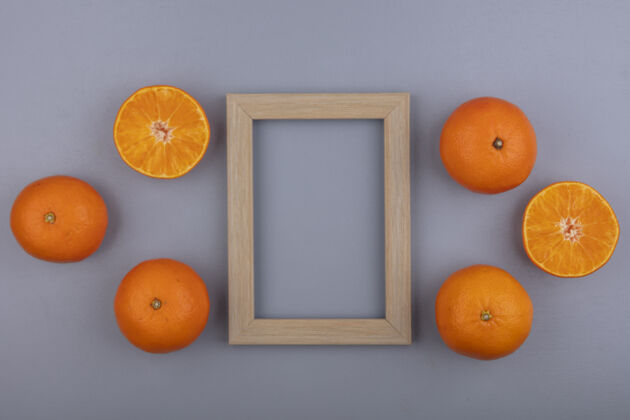 顶部顶视图复制空间橙色米色框架灰色背景橙色米色水果