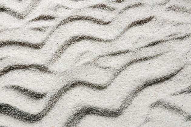 上用波浪线特写沙子关闭粉末顶